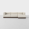 A modern, light beige sectional sofa with clean lines and a dark wooden base, set against a plain white background.