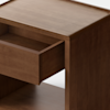 A modern wooden nightstand with a single drawer partially open, viewed from the side, set against a plain white background.