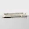 A modern, low-profile sectional sofa with cream-colored upholstery and a dark wooden base, displayed against a plain light background. The sofa has clean lines and an L-shaped design.