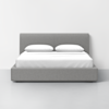 A modern, minimalist bed with a gray upholstered headboard and base, topped with white bedding and two white pillows, set against a plain white wall in a bright room.