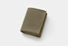 A neatly folded olive green muslin blanket is placed on a plain white background.