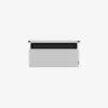 A minimalist, rectangular fabric wall organizer in light gray with a black strip and two mounting holes at the top, displayed against a plain white background.