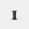 A minimalist wooden stool with a rectangular top and base, connected by a central rectangular support, set against a plain white background.