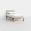 A minimalist single bed with a light wooden frame, a beige upholstered headboard, and white bedding, positioned against a plain white wall on a light gray floor.