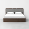 A modern bed with a dark wooden frame, a gray upholstered headboard, white bedding, and two white pillows, set against a plain white wall and light gray floor.