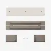 Four components and four screws for a wall-mounted item are arranged on a white background: a long beige panel, a mounting bracket, two rectangular wooden pieces, and four black screws.