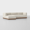 A modern L-shaped sectional sofa with light beige upholstery and a wooden base, set against a plain white background.