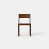 A simple, modern wooden chair with a flat seat, straight legs, and a rectangular backrest, positioned against a plain white background.