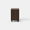 A dark wooden nightstand with a single open drawer and an open shelf below, standing on four short legs against a plain white background.
