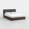 A modern bed with a dark wooden frame and a gray upholstered headboard, neatly made with white bedding and two pillows, set against a plain white background.