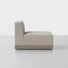 A modern armless sofa section with light beige upholstery and a wooden base, shown from the side against a plain white background.