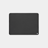 A large, rectangular black desk mat with rounded corners and a small white square logo in the bottom right corner, displayed on a plain light background.