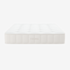 A white, rectangular mattress with tufted top and stitched sides, displaying the brand name THUMA on the side, photographed against a plain white background.