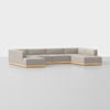 A modern L-shaped sectional sofa with light gray cushions and a low wooden base, set on a plain white background.