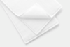 A neatly folded white towel with one corner turned up, displayed on a plain white background.