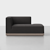 A modern, dark gray chaise lounge with clean lines, an L-shaped backrest on the left side, and a light wood base, set against a plain white background.