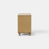 A modern wooden nightstand with an open rectangular design, one visible shelf at the bottom, and a single drawer partially open at the top. The nightstand stands on four short cylindrical legs.