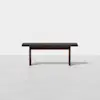 A simple, modern wooden bench with a dark finish, shown against a plain white background. The bench has straight legs and a rectangular seat.