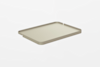 A rectangular, light beige tray with raised edges and a minimalist design, set against a plain white background.