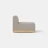 Side view of a modern, armless sofa seat with light gray upholstery and a wooden base, set against a plain white background.
