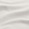 Close-up of a piece of white linen fabric with visible textured weave and soft, gentle folds creating a subtle wavy pattern across the surface.