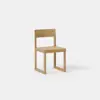 A simple wooden chair with a square seat, straight backrest, and minimalist design, placed against a plain white background.