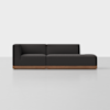 A modern dark gray sectional sofa with a left-arm chaise lounge, low backrest, and wooden base, set against a plain light background.