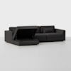 A modern dark gray sectional sofa with a chaise lounge, featuring a lift-up seat that reveals a hidden storage compartment, set against a plain white background.
