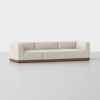 A modern, low-profile white sofa with three seats, square arms, and a wooden base, set against a plain light gray background.