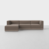 A modern, L-shaped sectional sofa with brown upholstery and low, boxy arms, set against a plain white background on a light-colored floor.