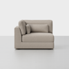 A white couch with a pillow.
