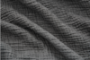 Close-up of dark gray, crinkled fabric with a textured, wavy pattern and visible ridges and folds, creating a sense of depth and softness.