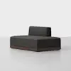 A modern, minimalist dark gray armless loveseat with a low backrest, squarish shape, and wooden base, set on a light gray floor against a plain white background.