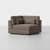 A modern, brown upholstered corner chair with clean lines, featuring a thick seat cushion, two back cushions, and a rectangular side pillow, set against a plain light gray background.