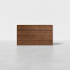 A modern wooden dresser with eight horizontal drawers, finished in a medium brown wood, standing on a smooth, light grey floor against a plain white background.
