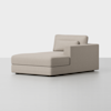 A modern beige chaise lounge with a right armrest and plush cushions sits on a light gray floor against a plain white background.