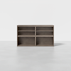 A wooden storage unit with six open rectangular shelves, arranged in two rows and three columns, standing on a light gray floor against a plain white background.
