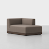 A modern, armless sectional sofa with a right-angle backrest, upholstered in brown fabric, sits on a dark wooden base against a plain white background.