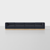 A long, modern sectional sofa with dark navy upholstery and a light wooden base, set against a plain white background.