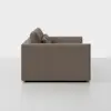A side view of a modern, boxy brown sofa with clean lines and two back cushions, set against a plain white background.
