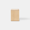 A minimalist wooden side table with a rectangular shape, open base, and a single drawer partially pulled out, set against a plain white background.
