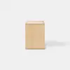 A minimalist wooden side table with a rectangular shape, open base, and a single drawer partially pulled out, set against a plain white background.
