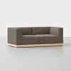 A modern, boxy brown sofa with angular armrests and a low wooden base, set against a plain white background.