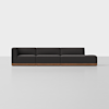 A modern, modular dark gray sectional sofa with a wooden base, featuring three seats and a chaise lounge on the right, set against a plain white background.