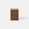 A modern wooden nightstand with a rectangular shape, an open lower shelf, and a single drawer partially pulled out, set against a plain white background.