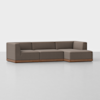 A modern sectional sofa with brown upholstery and a wooden base, featuring three seats and a chaise lounge on the right side, set against a plain white background.