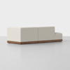 A modern, light beige sectional sofa with clean lines and a low backrest, set on a wooden base, positioned on a smooth, light gray floor against a plain white background.