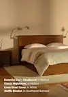 A cozy bedroom with a walnut wood bed and headboard, matching nightstand, white linen duvet cover, and a heathered oatmeal waffle blanket, softly lit with wall-mounted lamps. Text in the corner lists the featured products.