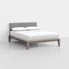 A modern bed with a light wooden frame, a gray upholstered headboard, white bedding, and two pillows, set against a plain white background.