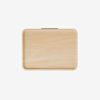 A rectangular wooden tray with rounded corners is shown against a plain white background. The tray has a smooth, light wood finish and a small black handle at the top edge.